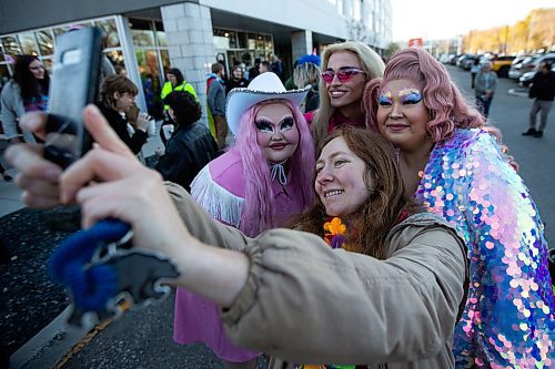 Daniel Crump / Winnipeg Free Press. Ceara Desmond takes a selfie with drag queens, Rose Mortel, left, Glimmer and Mei Yosong who took part in a drag queen story time event at Scout coffee shop in North Kildonan. October 29, 2022.