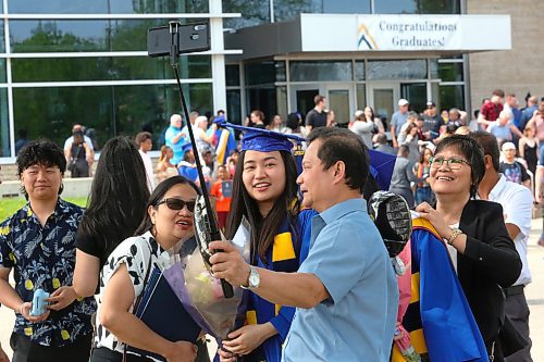 Brandon University Faculty of Health Studies graduates meet up with friends and family outside the Healthy Living Centre after Friday morning's convocation ceremony came to a close. (Kyle Darbyson/The Brandon Sun)