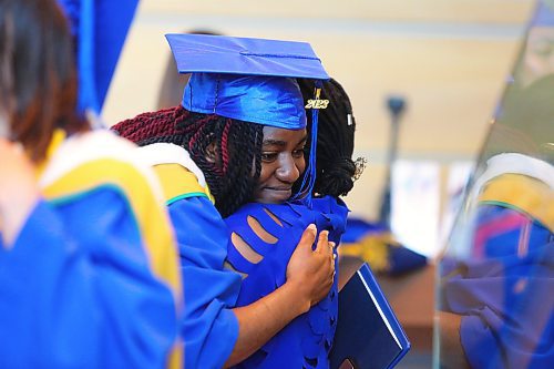 Brandon University graduate Toluwalope Adewuyi hugs a friend in the lobby of the Healthy Living Centre after receiving her Bachelor of Science in Psychiatric Nursing degree during Friday morning's convocation ceremony. (Kyle Darbyson/The Brandon Sun)