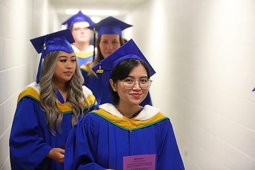 Faculty of Science graduates line up outside the Healthy Living Centre's main gymnasium Friday morning to receive their diplomas during the final day of Brandon University's 2023 convocation. (Kyle Darbyson/The Brandon Sun)
