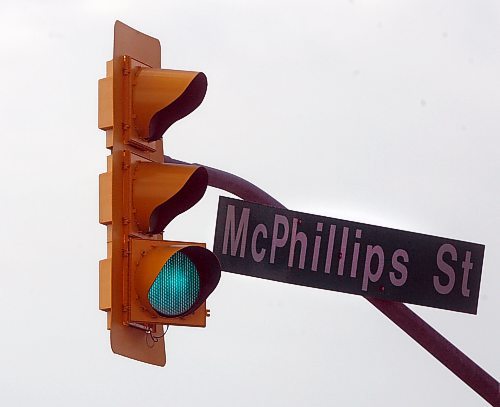 Stdup- Wink &amp; a Nod sends traffic moving from a green traffic light signal light turned sideways by Tuesday's 70 Km/hr winds on McPhillips St at Mountain Ave  KEN GIGLIOTTI / May 15  2013 / WINNIPEG FREE PRESS