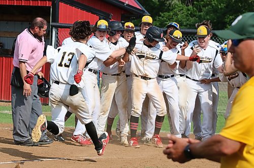 The Garden City Gophers let Jackson Thiessen (13) cross the plate after his walk-off grand slam in the bottom of the seventh inning that gave his team a 16-12 victory over the Boissevain-Wawanesa Broncos co-op team in the Manitoba High School Athletic Association final in Glenboro on Saturday afternoon. (Perry Bergson/The Brandon Sun)