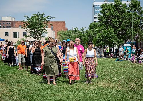 JESSICA LEE / WINNIPEG FREE PRESS

From left to right: MLA Lisa Naylor, Geraldine Shingoose and MP Leah Gazan walk during the grand entrance of a pow wow celebrating the five year anniversary of West Broadway Bear Clan at West Broadway Neighbourhood Centre June 3, 2023.

Reporter: Malak Abas