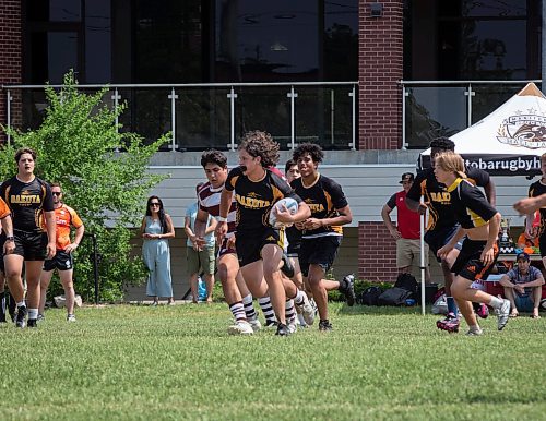 JESSICA LEE / WINNIPEG FREE PRESS

Dakota Collegiate rugby player Jose Astroga holds the ball during a finals game June 3, 2023 against St. Paul&#x2019;s at St. Paul&#x2019;s High School. The final score was 26-19 with St. Paul&#x2019;s winning.

Stand up