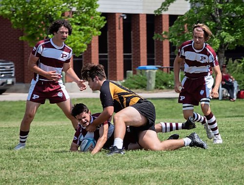 JESSICA LEE / WINNIPEG FREE PRESS

A Dakota Collegiate rugby player is tackled with the ball during a finals game June 3, 2023 against St. Paul&#x2019;s at St. Paul&#x2019;s High School. The final score was 26-19 with St. Paul&#x2019;s winning.

Stand up
