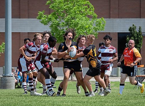 JESSICA LEE / WINNIPEG FREE PRESS

Dakota Collegiate rugby player Jose Astroga holds the ball during a finals game June 3, 2023 against St. Paul&#x2019;s at St. Paul&#x2019;s High School. The final score was 26-19 with St. Paul&#x2019;s winning.

Stand up