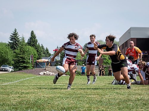 JESSICA LEE / WINNIPEG FREE PRESS

St. Paul&#x2019;s High School rugby player Dario Macchia (left) kicks the ball during a finals game June 3, 2023 against Dakota Collegiate at St. Paul&#x2019;s High School. The final score was 26-19 with St. Paul&#x2019;s winning.

Stand up