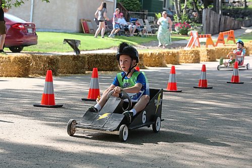 Kiwanis Kar Derby participant Ryder Gray takes the lead during a preliminary round race on Saturday morning in east Brandon. (Kyle Darbyson/The Brandon Sun)