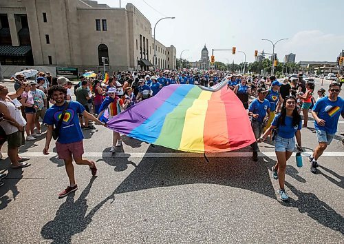 About 10,000 individuals and over 160 groups registered to walk in the parade which snaked from Memorial Boulevard down Portage Avenue and Main Street to The Forks in Winnipeg. (John Woods/Winnipeg Free Press)