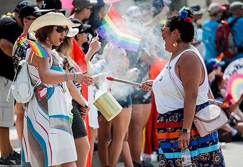 JOHN WOODS / WINNIPEG FREE PRESS
People smudge at the Pride Parade in Winnipeg Sunday, June 4, 2023. 

Re: pindera