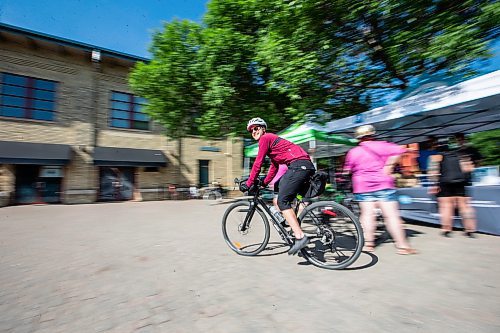 MIKAELA MACKENZIE / WINNIPEG FREE PRESS
Cyclist Eric Bohemier bikes away from a Bike Week booth at The Forks on Monday, June 5, 2023. This is the 15th annual Bike to Work Day. Standup.
Winnipeg Free Press 2023