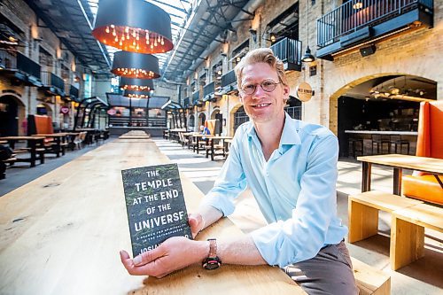 MIKAELA MACKENZIE / WINNIPEG FREE PRESS

Author Josiah Neufeld poses for a photo with his newest book at The Forks on Monday, June 5, 2023.  For Ben Sigurdson story.
Winnipeg Free Press 2023