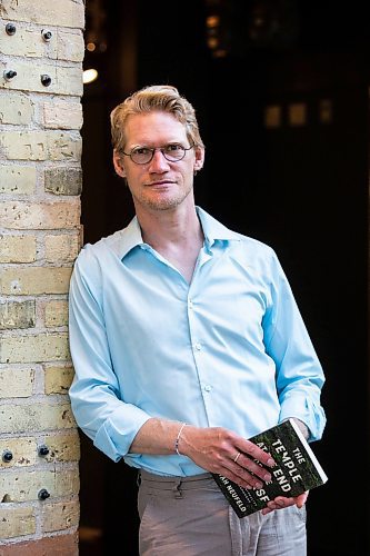 MIKAELA MACKENZIE / WINNIPEG FREE PRESS

Author Josiah Neufeld poses for a photo with his newest book at The Forks on Monday, June 5, 2023.  For Ben Sigurdson story.
Winnipeg Free Press 2023