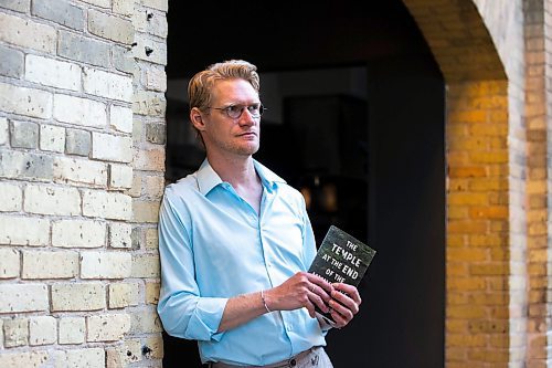 MIKAELA MACKENZIE / WINNIPEG FREE PRESS

Author Josiah Neufeld poses for a photo with his newest book at The Forks on Monday, June 5, 2023.  For Ben Sigurdson story.
Winnipeg Free Press 2023