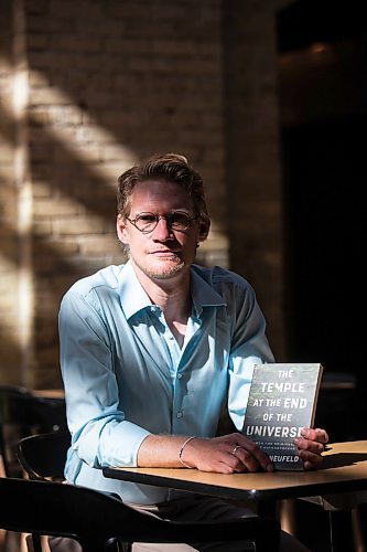 MIKAELA MACKENZIE / WINNIPEG FREE PRESS

Author Josiah Neufeld poses for a photo with his newest book at The Forks on Monday, June 5, 2023.  For Ben Sigurdson story.
Winnipeg Free Press 2023