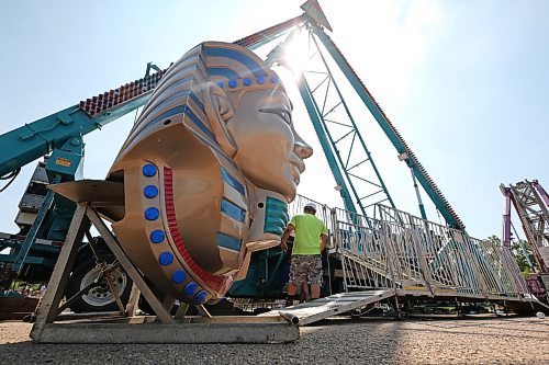 One of two gian pharoah heads waits to be attached to the Pharoah's Fury ride on Monday morning at the Keystone Centre parking lot. North American Midway employees were readying the rides and midway yesterday in anticipation of Wednesday afternoon's opening of the Manitoba Summer Fair. (Matt Goerzen/The Brandon Sun)
