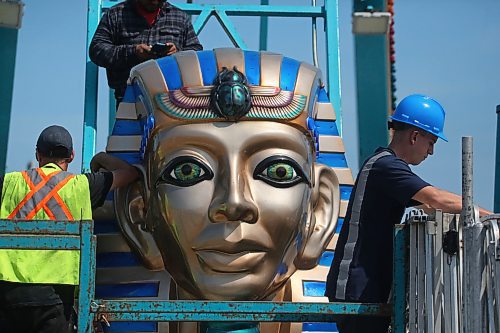 The eyes of the pharoah look into the camera while North American Midway employees construct the Pharoah's Fury ride at the Keystone Centre parking lot on Monday afternoon, in anticipation of the Manitoba Summer Fair, which opens on Wednesday afternoon. (Matt Goerzen/The Brandon Sun)