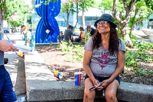 MIKAELA MACKENZIE / WINNIPEG FREE PRESS


Janet Jandrew speaks to the Free Press at Air Canada Window Park on Tuesday, June 6, 2023. She comes outside to sit in the shade, as her sixth floor apartment does not have air conditioning. For Chris Kitching story.
Winnipeg Free Press 2023