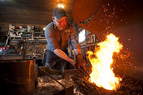 MIKE DEAL / WINNIPEG FREE PRESS

Matt Jenkins co-owner of Cloverdale Forge works on an axe head that will be on display at the Manitoba Museum in the newly renovated Nonsuch gallery.

180419 - Thursday, April 19, 2018.