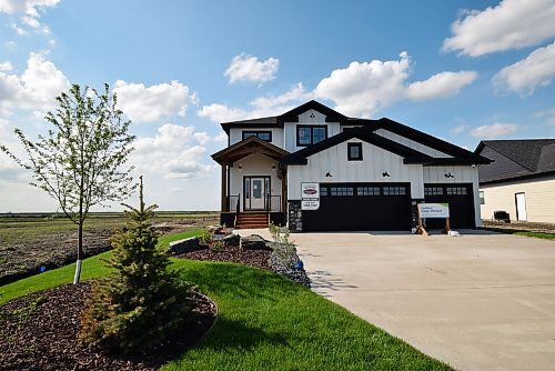 Photos by Todd Lewys / Winnipeg Free Press
The Glenridge design from Kensington Homes fits perfectly into its countrified surroundings.