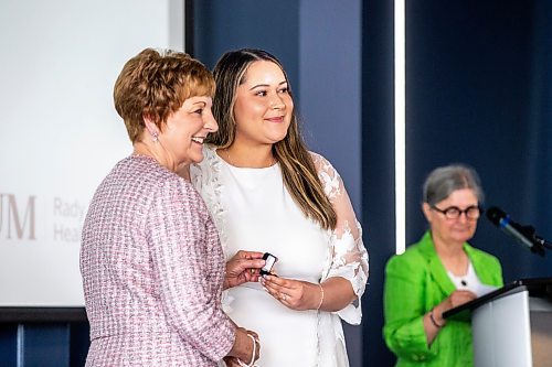 MIKAELA MACKENZIE / WINNIPEG FREE PRESS


Winter Traverse recieves her pin from dean Netha Dyck at the College of Nursing graduating class of 2023 pinning ceremony at the IG Field Pinnacle Club on Wednesday, June 7, 2023. For Cierra story.
Winnipeg Free Press 2023