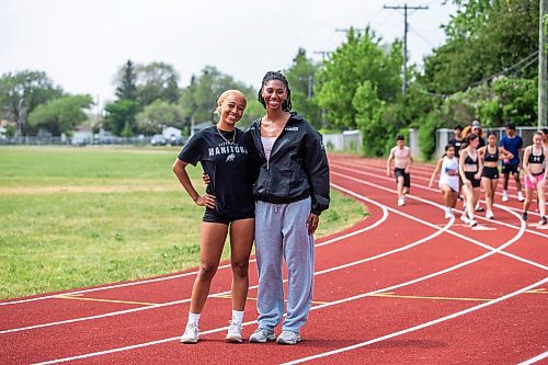 Garden City Gophers sisters Arriana, left, and Amira Lawrence pose at track and field practice on Wednesday, ahead of today's MHSAA provincial championships in Brandon. (Mikaela MacKenzie/Winnipeg Free PRess)