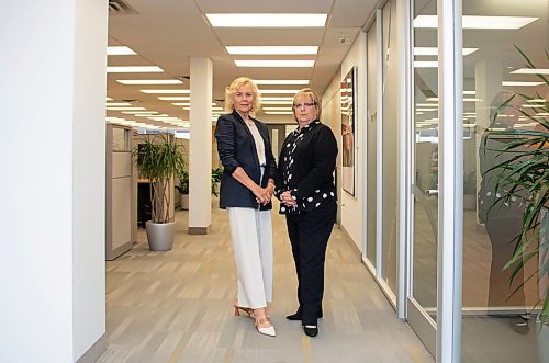 Mike Thiessen / Winnipeg Free Press   Lee Meagher and Barb Gamey in the Payworks office.   230607 &#x2013; Wednesday, June 7, 2023