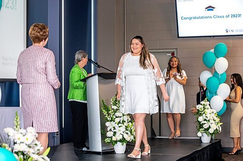 MIKAELA MACKENZIE / WINNIPEG FREE PRESS


Winter Traverse recieves her pin from dean Netha Dyck at the College of Nursing graduating class of 2023 pinning ceremony at the IG Field Pinnacle Club on Wednesday, June 7, 2023. For Cierra story.
Winnipeg Free Press 2023