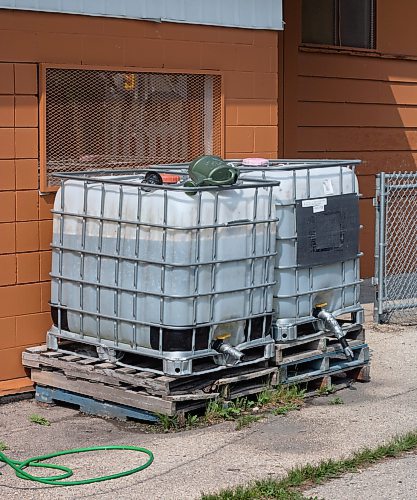Mike Thiessen / Winnipeg Free Press
Water tanks at Orioles Community Garden in Winnipeg&#x2019;s West End. Orioles Community Garden is one of few gardens in the city with on-site water access.   230607 &#x2013; June 7, 2023