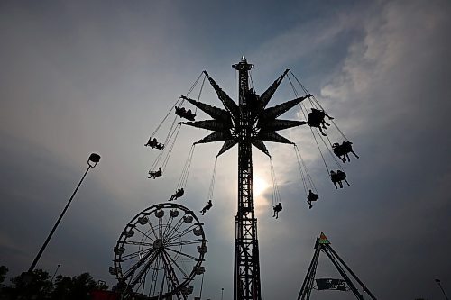 07062023
Fair-goers ride the swing tower on the midway at the opening night of the 2023 Manitoba Summer Fair at the Keystone Centre on a hot and stormy Wednesday night. (Tim Smith/The Brandon Sun)