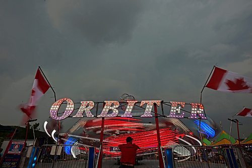 07062023
Fair-goers ride the Orbiter amid stormy skies on the opening night of the 2023 Manitoba Summer Fair at the Keystone Centre. (Tim Smith/The Brandon Sun)