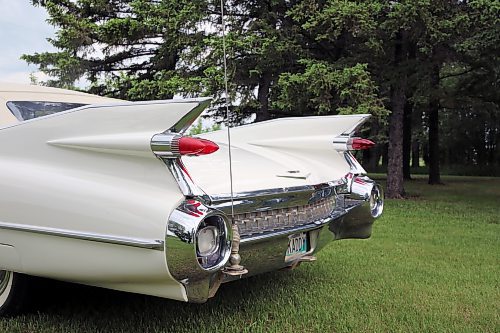 The iconic high tailfins and double tail lights on Elwin and Elaine Kettner's 1959 Cadillac 2-door convertible, as it sits in a park near their home northwest of Brandon on Thursday. (Michele McDougall/The Brandon Sun) 