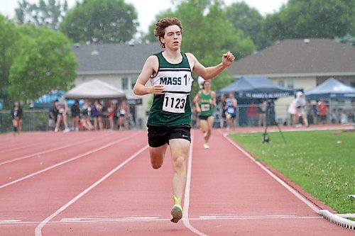 Alejandro Civetta of the Vincent Massey Trojans watches for his time as he crosses the finish line first in the varsity boys' 1,500-metre. (Thomas Friesen/The Brandon Sun)