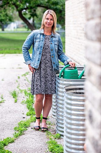 MIKAELA MACKENZIE / WINNIPEG FREE PRESS


Marcie Wood, director of Willow Place (a family violence shelter), poses for a photo with the new garden boxes on Thursday, June 8, 2023. The shelter is one of 12 community organizations that recieved funding through Winnipeg Food Council&#x2019;s Community Gardens and Urban Agriculture small grants program. For &#x2014; story.
Winnipeg Free Press 2023