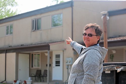 Eva Cameron, the chair of the board of directors for the Spruce Woods Housing Co-op in Brandon, points to water and mould damage on one of the townhouses at the complex. (Colin Slark/The Brandon Sun)