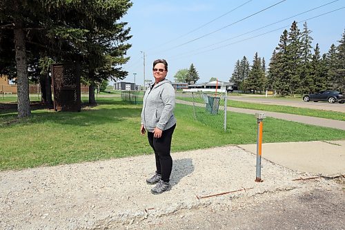 Eva Cameron of the Spruce Woods Housing Co-op in Brandon shows off the crumbling sidewalk next to one of the complex's parking lot. She estimates the co-op has $3.5 million worth of outstanding renovations and repairs to complete. (Colin Slark/The Brandon Sun)