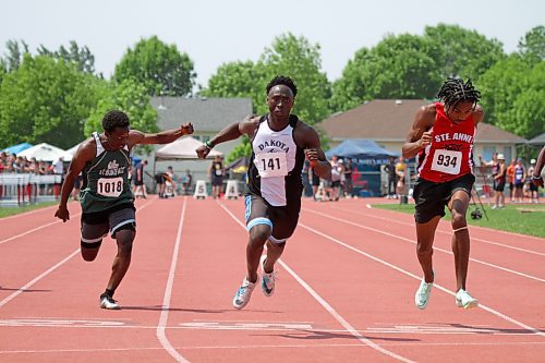 Dakota's Augustine Nkundimana, centre, claimed the varsity boys' 100-metre dash gold at high school track and field provincials at Brandon's UCT Stadium on Friday. (Thomas Friesen/The Brandon Sun)
