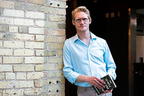 MIKAELA MACKENZIE / WINNIPEG FREE PRESS

Author Josiah Neufeld poses for a photo with his newest book at The Forks on Monday, June 5, 2023.  For Ben Sigurdson story.
Winnipeg Free Press 2023