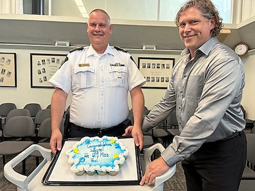 Police board member Mayor Jeff Fawcett stands beside cupcakes that the board provided for Brandon Police Service Chief Wayne Balcaen's last police board meeting after he announced his retirement last week. (Geena Mortfield/The Brandon Sun)