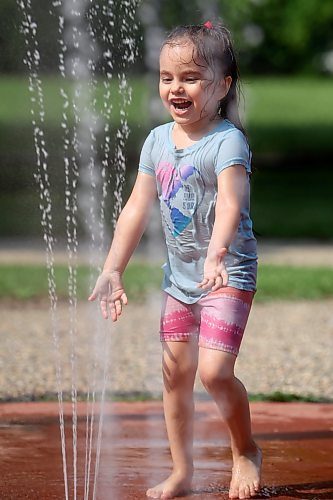 Ayvah Brass plays in the water at the Stanley Park spray park in Brandon on Friday. Brandon’s spray parks opened for the summer on Thursday. (Tim Smith/The Brandon Sun)