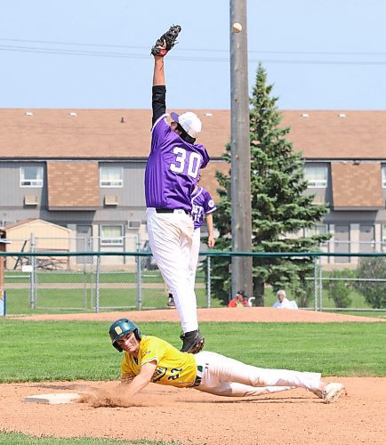 Vincent Massey Vikings first baseman Brannigan Ferland (30) jumps to try to pull in a quick pickoff attempt from the plate as Boissevain-Wawanesa Broncos base runner Connor Martin (27) dives back safely during the Prairie West High School Baseball League championship game at Andrews Field on Friday afternoon. Boissevain won 11-1 to win defend its title. (Perry Bergson/The Brandon Sun)