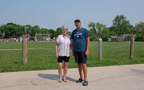 Mike Thiessen / Winnipeg Free Press 
Laura (left) and Viktor Lewin are concerned with the lack of a fence between OV Jewitt Community School and the back lane near their property, which has resulted in disruption to the yards of the couple and their neighbours. 230609 &#x2013; Friday, June 9, 2023