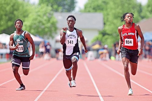 09062023
Elijah Falade of St. Boniface Diocesan High School, Angus Nkundimana of Dakota Collegiate and Jared Hiebert of St. Anne Collegiate sprint during the Varsity Boys 100 Meter Dash at the MHSAA Provincial Track &amp; Field Championships at UCT Stadium on Friday. 
(Tim Smith/The Brandon Sun)