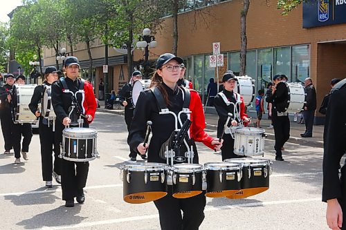 Members of the Crocus Plains/École Neelin Drumline perform an energetic set for the spectators of this year's Travellers' Day Parade in downtown Brandon. (Kyle Darbyson/The Brandon Sun) 