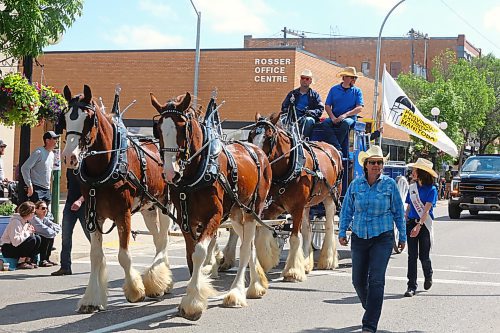 Members of Hillcrest Farms from Carroll, Man. ride down Rosser Avenue during the opening leg of this year's Travellers' Days Parade. (Kyle Darbyson/The Brandon Sun)