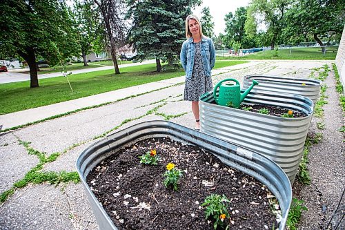 MIKAELA MACKENZIE / WINNIPEG FREE PRESS


Marcie Wood, director of Willow Place (a family violence shelter), poses for a photo with the new garden boxes on Thursday, June 8, 2023. The shelter is one of 12 community organizations that recieved funding through Winnipeg Food Council&#x2019;s Community Gardens and Urban Agriculture small grants program. For &#x2014; story.
Winnipeg Free Press 2023