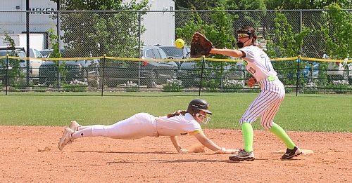 Westman Magic base runner Kamryn Boden of Russell (16) dives safely back to the bag as Eastman Magic second baseman Lexi Remillard (73) of St, Malo waits to make the catch and throw down a tag during the final of the International Classic’s gold medal game at the Ashley Neufeld Softball Complex in Brandon on Sunday afternoon. Westman won 7-4. (Perry Bergson/The Brandon Sun)
