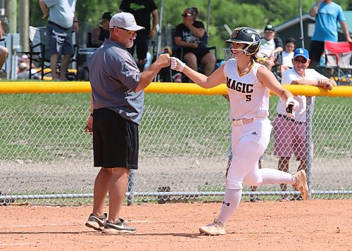 Jessie Henry (5) of the Westman Magic fist bumps head coach Faron Asham as the Virden product rounds the bases following a home run during the final of the International Classic&#x2019;s gold medal game at the Ashley Neufeld Softball Complex in Brandon on Sunday afternoon. Westman won 7-4. (Perry Bergson/The Brandon Sun)