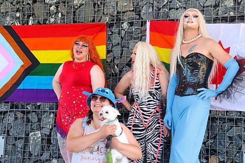 Westman dog owners pose for a group photo alongside members of the House of Hex during Sunday’s “Pooch Pride” event at the Riverbank Discovery Centre grounds. (Kyle Darbyson/The Brandon Sun)