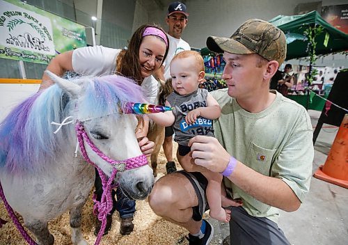 JOHN WOODS / WINNIPEG FREE PRESS
Brendon Murray and his son Bronte say hello to Missy, the miniature horse, as Candice Cronin and Ryan Steele, owners of Wild Willow Ranch and Rescue look on during the Manitoba Pet Expo at St Norbert community centre in Winnipeg, Sunday, June 11, 2023. Wild Willow Ranch and Rescue is a farm rescue and fundraise by dressing-up horses and attending parties and events.

Re: ?